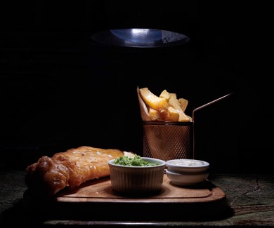 Classic fish and chips with mushy peas served at an Inveraray restaurant, part of the dining experience at hotels in Inveraray. ?? ''