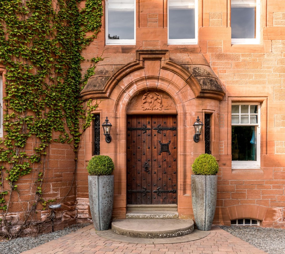 Wooden Castle Doors Surrounded by Brick With Ivy at Fonab Castle Hotel in Pitlochry ?? ''